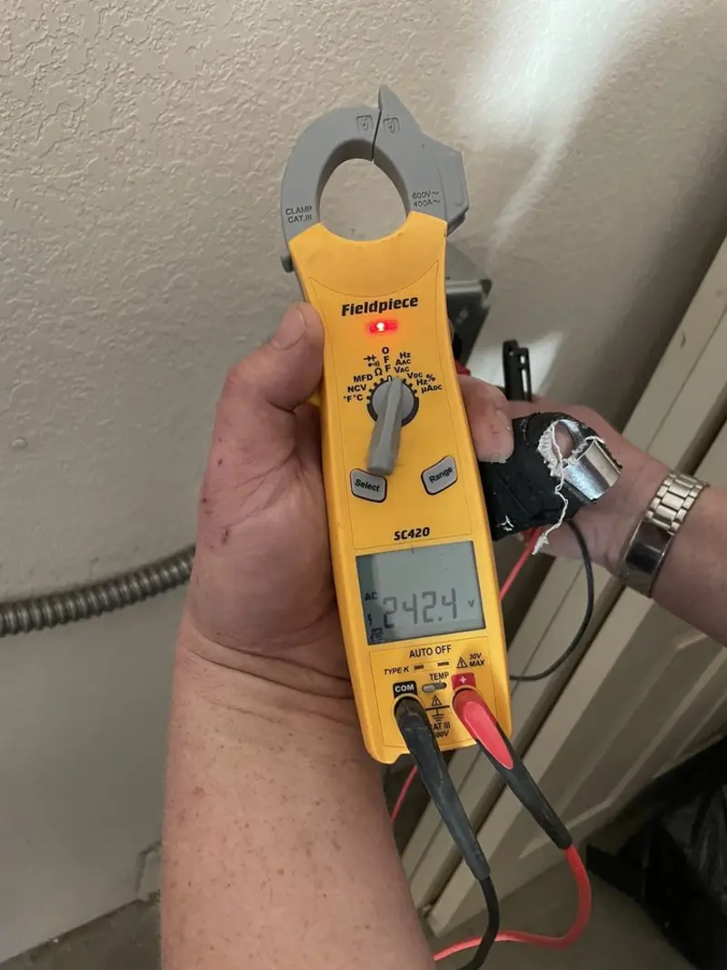 Voltage testing with clamp meter during Ceiling Fan Installation in Mayfield